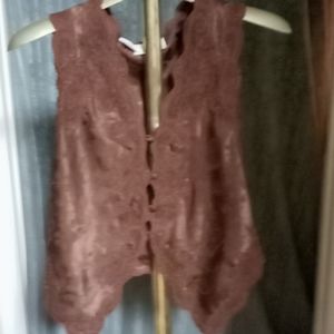 Brown. Sleeveless vest